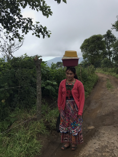 Mayan girl in Guatemala with basket on head